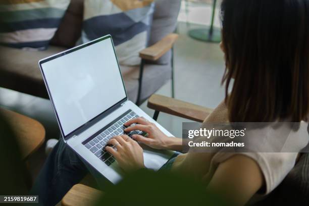 woman hands working with blank screen laptop computer.hands at work with digital technology.over shoulder view of working on desk.planing and working with mobile device screen template. - blank screen stock pictures, royalty-free photos & images