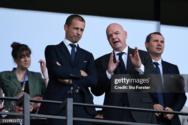 Aleksander Ceferin, President of UEFA, speaks with Gianni Infantino, President of FIFA , prior to the UEFA EURO 2024 round of 16 match between...