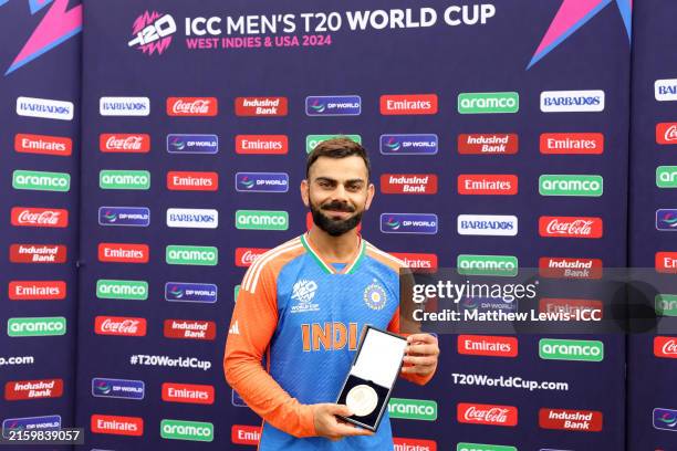 Virat Kohli of India poses for a photo with the Player of the Match award following the ICC Men's T20 Cricket World Cup West Indies & USA 2024 Final...