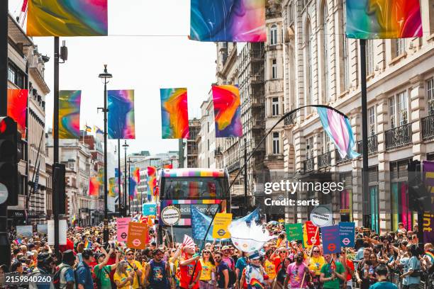 crowds celebrate at lgbt gay pride parade on streets of central london, uk - piccadilly stock pictures, royalty-free photos & images