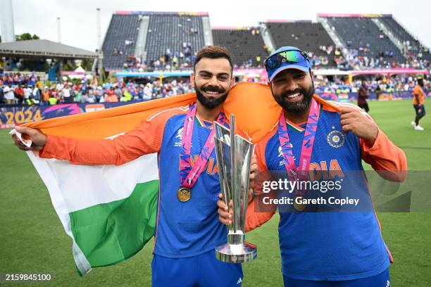 Virat Kohli and Rohit Sharma of India celebrates with the ICC Men's T20 Cricket World Cup following the ICC Men's T20 Cricket World Cup West Indies &...