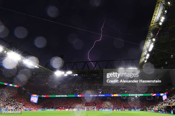 General view inside the stadium as a lightening is seen during the UEFA EURO 2024 round of 16 match between Germany and Denmark at Football Stadium...