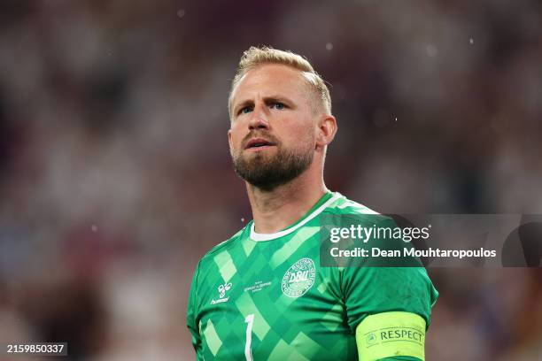 Kasper Schmeichel of Denmark reacts after Kai Havertz of Germany scores his team's first goal from a penalty kick during the UEFA EURO 2024 round of...