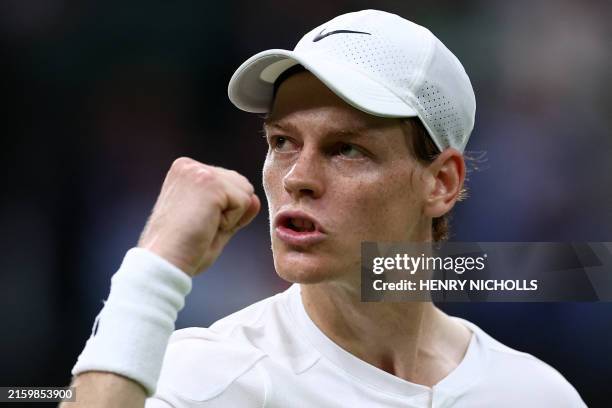 Italy's Jannik Sinner celebrates winning the second set against Italy's Matteo Berrettini during their men's singles second round tennis match on the...