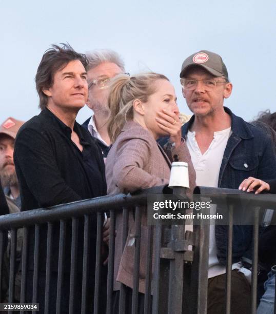 Tom Cruise and Simon Pegg ahead of Coldplay performing during day four of Glastonbury Festival 2024 at Worthy Farm, Pilton on June 29, 2024 in...
