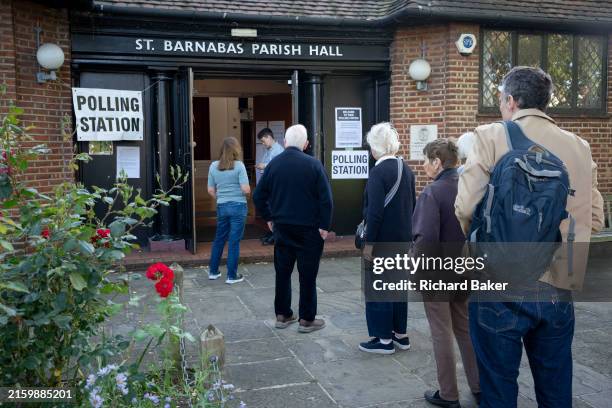 The first voters in the 2024 general election enter the polling station at St Barnabas Parish Hall in Dulwich Village, on 4th July 2024, in south...