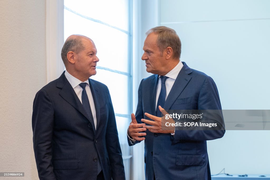 German Chancellor Olaf Scholz (L) and Prime Minister Donald...