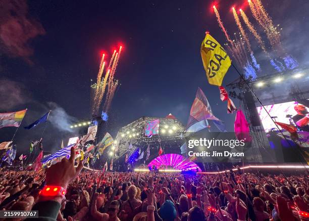 Fireworks explode as Coldplay perform on the Pyramid stage during day four of Glastonbury Festival 2024 at Worthy Farm, Pilton on June 29, 2024 in...
