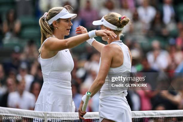 Winner Britain's Harriet Dart hugs Britain's Katie Boulter at the end of their women's singles tennis match on the fourth day of the 2024 Wimbledon...