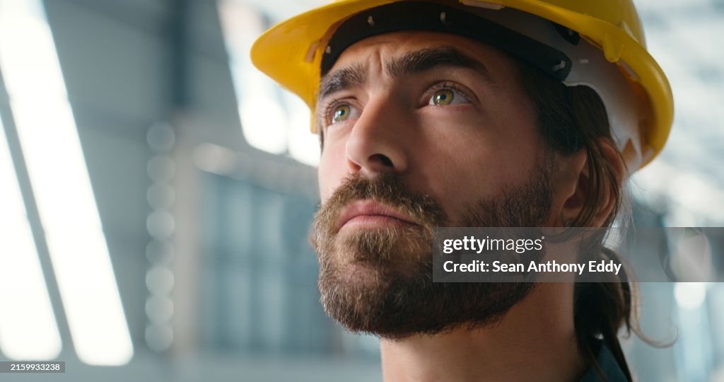 Construction, thinking and man in building for planning, maintenance and architecture design. Face of civil engineering contractor brainstorming for manufacturing, storage warehouse and factory ideas