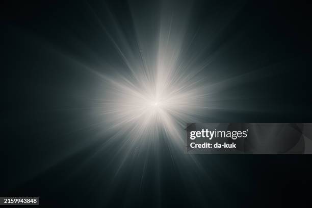 lens flare on black background. overlay design element - rayo de luz fotografías e imágenes de stock