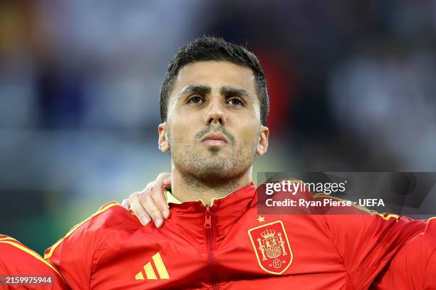 Rodri of Spain stands for the national anthem prior to the UEFA EURO 2024 round of 16 match between Spain and Georgia at Cologne Stadium on June 30,...