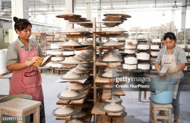 Technician is making daily porcelain for export at the China Jingdezhen Porcelain Factory in Jingdezhen, China, on July 4, 2024.