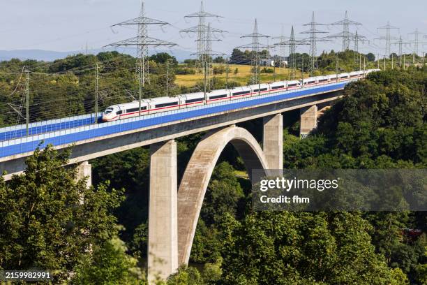 german high speed train ice (intercity express) on a large bridge (lahntalbrücke) - germany stock pictures, royalty-free photos & images