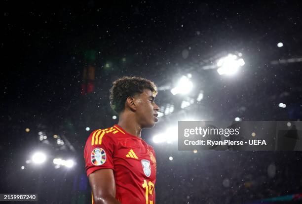 Lamine Yamal of Spain looks on after the team's victory and progression to the quarter final in the UEFA EURO 2024 round of 16 match between Spain...