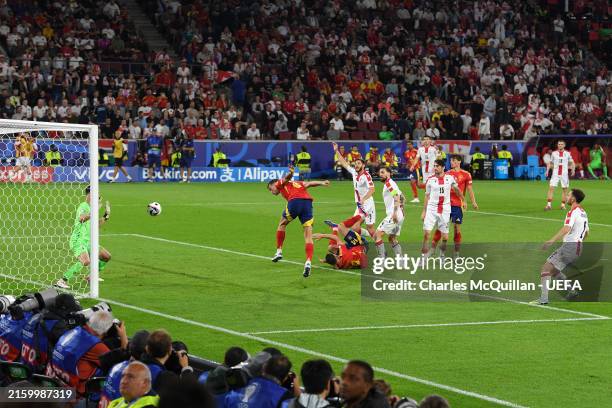 Fabian Ruiz of Spain scores his team's second goal past Giorgi Mamardashvili of Georgia during the UEFA EURO 2024 round of 16 match between Spain and...
