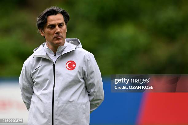 Turkey's Italian head coach Vincenzo Montella attends a training session at the team's base camp in Barsinghausen on July 5 during their MD-1...