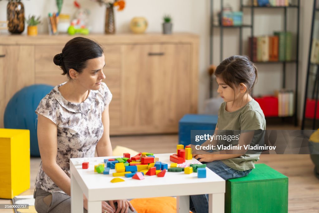 Woman and child with colorful blocks