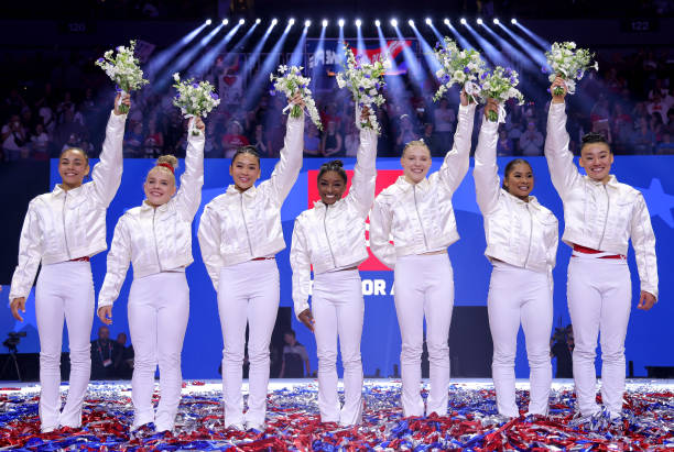 Hezly Rivera, Joscelyn Roberson, Suni Lee, Simone Biles, Jade Carey, Jordan Chiles and Leanne Wong pose after being selected for the 2024 U.S....