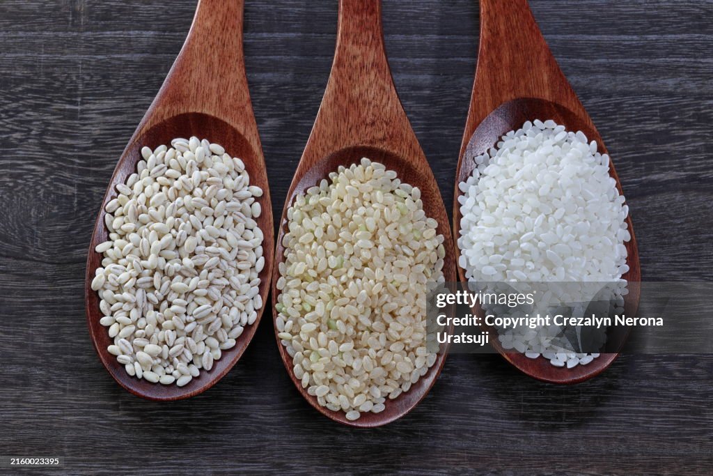 Variety of Rice. Raw Barley Rice,White Rice and Brown Rice on Spoon