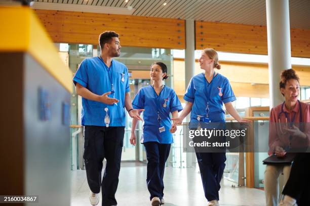 nursing students in hospital corridor - sales executive stock pictures, royalty-free photos & images