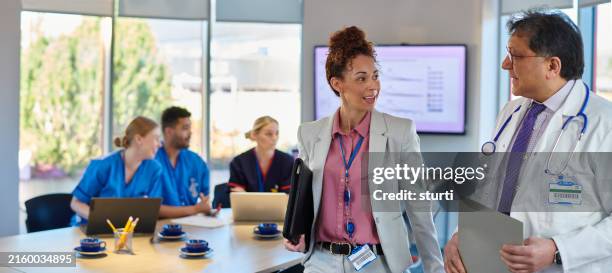 medical meeting with pharmaceutical representatives - medical sales representative stock pictures, royalty-free photos & images