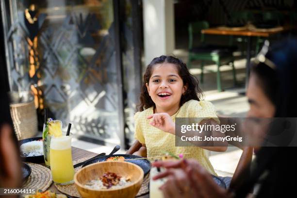 happy young saudi girl vacationing with family - jeddah stock pictures, royalty-free photos & images