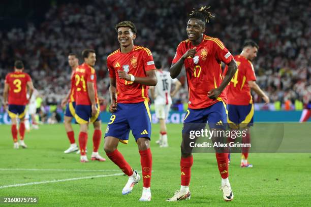 Nico Williams of Spain celebrates scoring his team's third goal with teammate Lamine Yamal during the UEFA EURO 2024 round of 16 match between Spain...