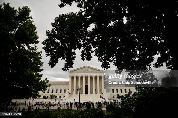 Demonstrators, members of the media, and bystanders gather outside the U.S. Supreme Court on July 01, 2024 in Washington, DC. The Supreme Court...
