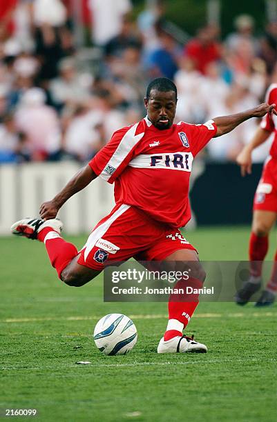 Andy Williams of the Chicago Fire strikes the ball during their MLS game against the NY/NJ MetroStars on June 28, 2003 at Cardinal Stadium in...