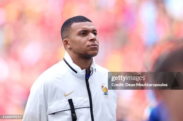 Kylian Mbappe of France looks on as he lines up during the National Anthems prior to the UEFA EURO 2024 round of 16 match between France and Belgium...