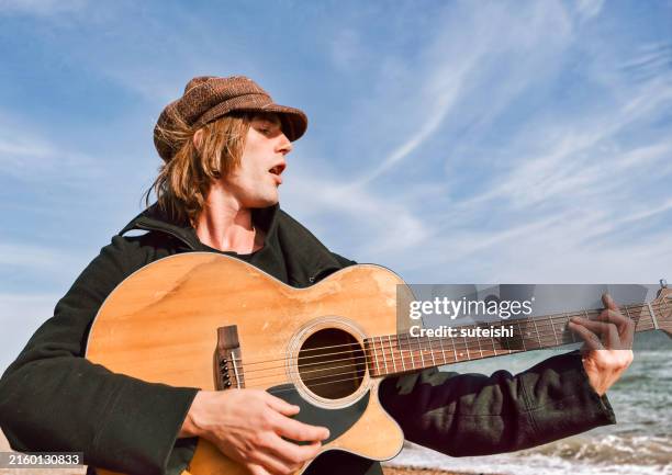 the guitar player. - jazz hat stock pictures, royalty-free photos & images