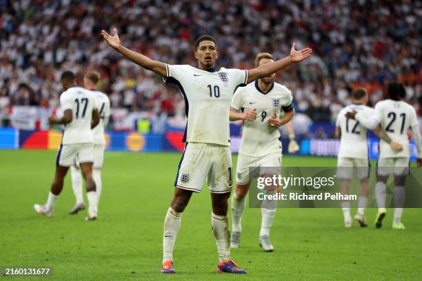 Jude Bellingham of England celebrates scoring his team's first goal during the UEFA EURO 2024 round of 16 match between England and Slovakia at Arena...