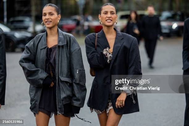 Twins wearing black oversized grey leather jacket, blazer outside Lueder during the Berlin Fashion Week SS25 on July 01, 2024 in Berlin, Germany.