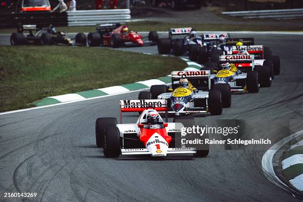 Alain Prost, McLaren MP4-2C TAG, leads Nigel Mansell and Nelson... News ...