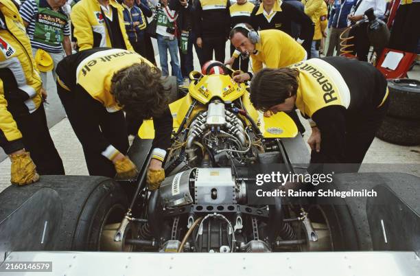 Mechanics work on Jean-Pierre Jabouille's Renault RS01 in the pits during the British GP at Silverstone on July 16, 1977 in Silverstone, United...