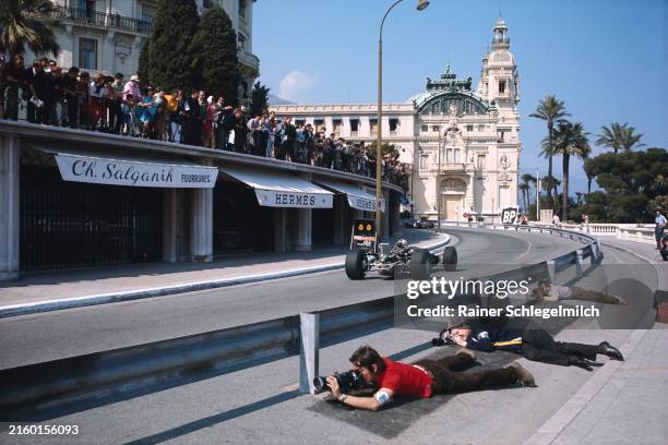 Photographers shoot from below the new barriers on the approach to Casino Square during the Monaco GP at Monte Carlo on May 26, 1968 in Monte Carlo,...