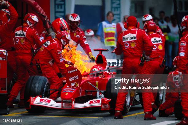 Michael Schumacher's Ferrari F2003-GA, catches fire during a pitstop during the Austrian GP at the A1-Ring on May 18, 2003 in Spielberg, Styria,...