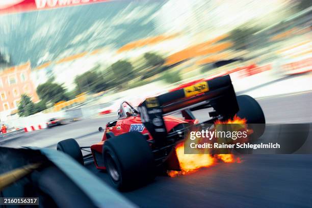 Exhaust flames shoot up through the diffuser of the Ferrari 156/85 of Stefan Johansson as he exits Rascasse corner during the Monaco GP at Circuit de...