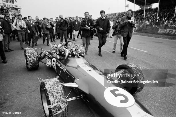 Jim Clark, Lotus 49 Ford, celebrates victory on the debut of the Ford DFV engine during the Dutch GP at Zandvoort on June 04, 1967 in Zandvoort,...