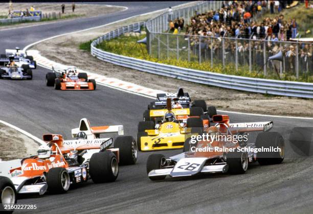 Gijs van Lennep, Williams IR01 Ford, takes a wider line than team mate Howden Ganley in the Williams IR02 Ford during the Dutch GP at Circuit...