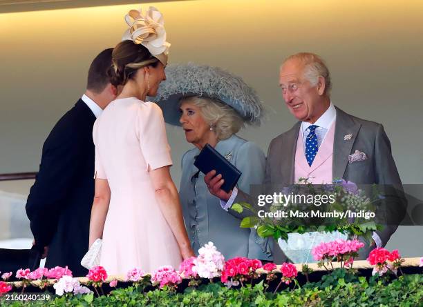 Peter Phillips, Harriet Sperling, Queen Camilla and King Charles III watch the racing from the royal box as they attend day four of Royal Ascot 2024...