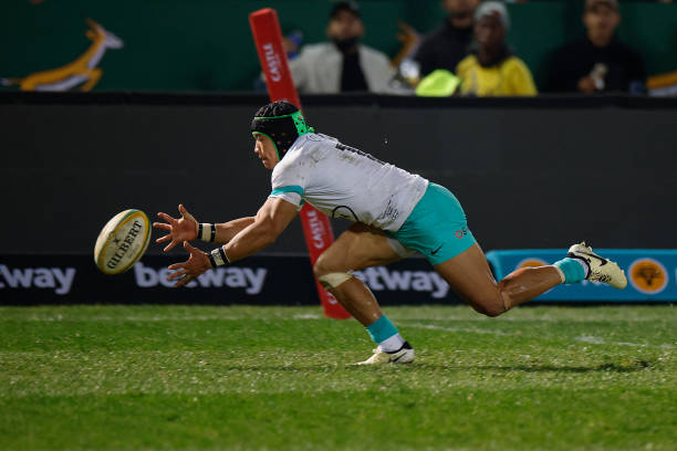 South Africa's wing Cheslin Kolbe scores his team's second try during the first Rugby Union test match between South Africa and Ireland at Loftus...