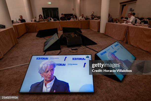 Accredited journalists follow onscreen from the pressroom the President of the European Central Bank Christine Lagarde delivering remarks during the...