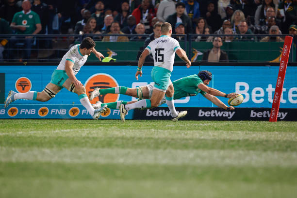 Ireland's Ryan Baird dives to score a try during the first Rugby Union test match between South Africa and Ireland at Loftus Versfeld stadium in...