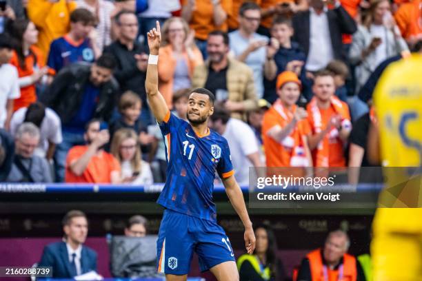 Cody Gakpo of the Netherlands celebrates after scoring his team's first goal during the UEFA EURO 2024 round of 16 match between Romania and...