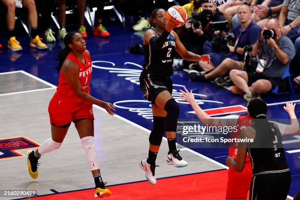 New York Liberty forward Kennedy Burke drives along the baseline and goes in for two during a WNBA game between the New York Liberty and the Indiana...