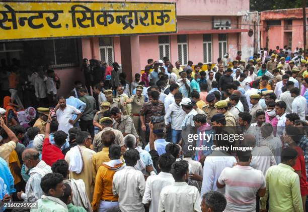 Relatives of victims who died in a stampede gather outside a hospital on July 02, 2024 in Hathras, India. At least 116 people were confirmed killed...