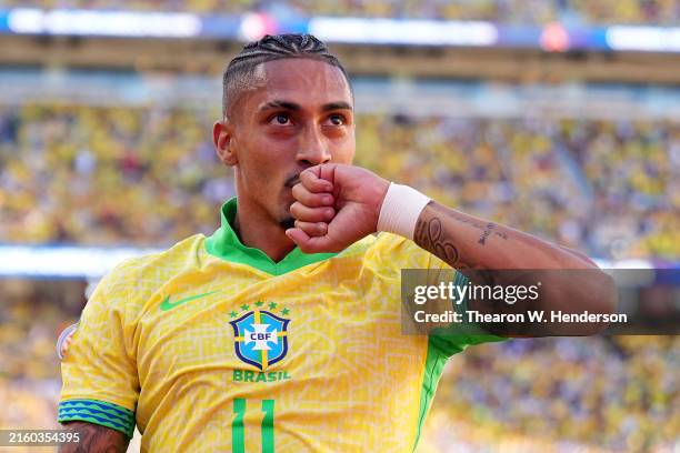 Raphinha of Brazil celebrates after scoring the team's first goal during the CONMEBOL Copa America 2024 Group D match between Brazil and Colombia at...