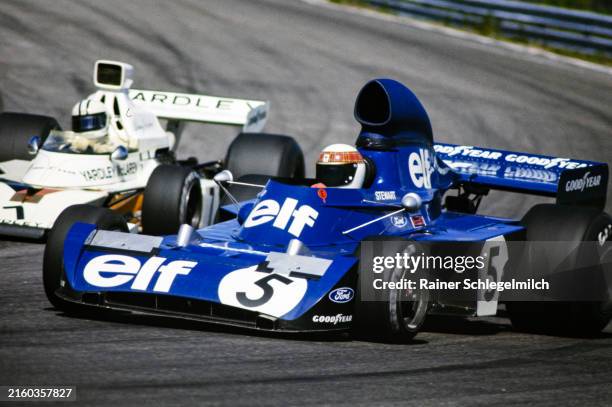 Jackie Stewart, Tyrrell 006 Ford leads Denny Hulme, McLaren M23 Ford during the Swedish GP at Anderstorp Raceway on Sunday June 17 Sweden.
